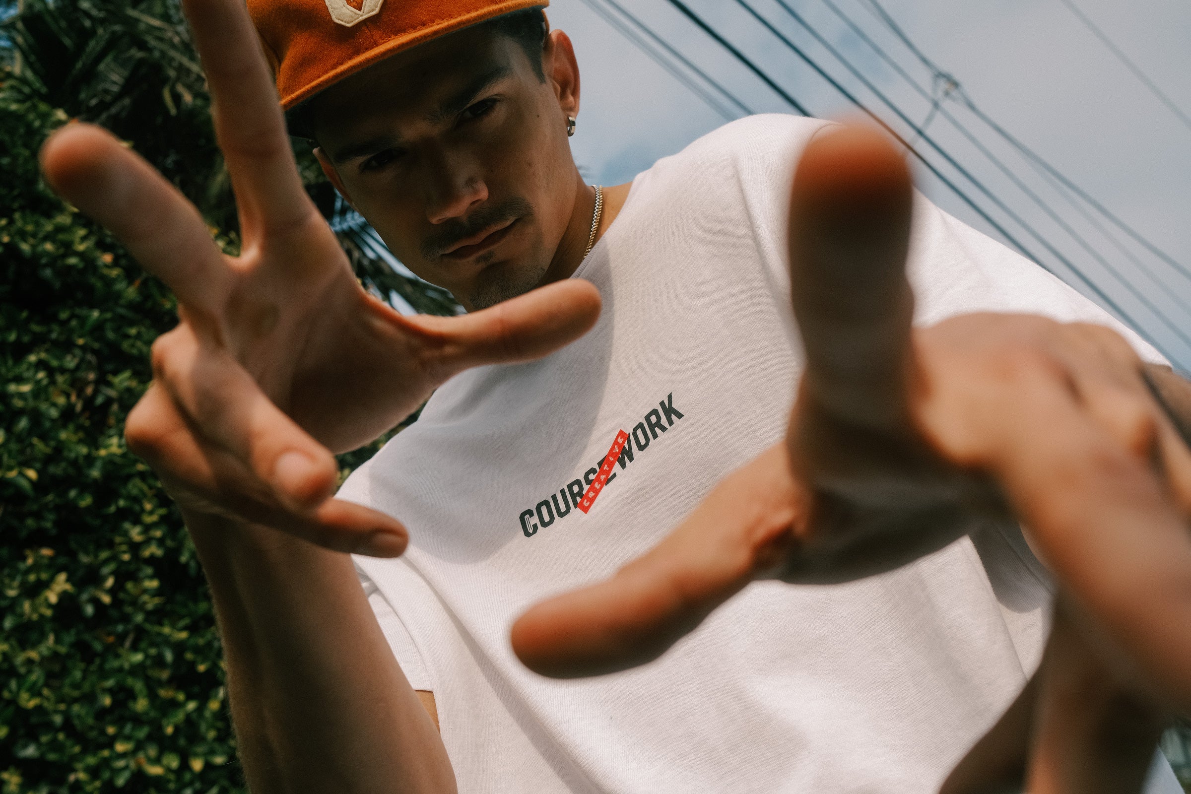 Model wearing the Creative Label tee and Ebbets Wool C Cap in Camel