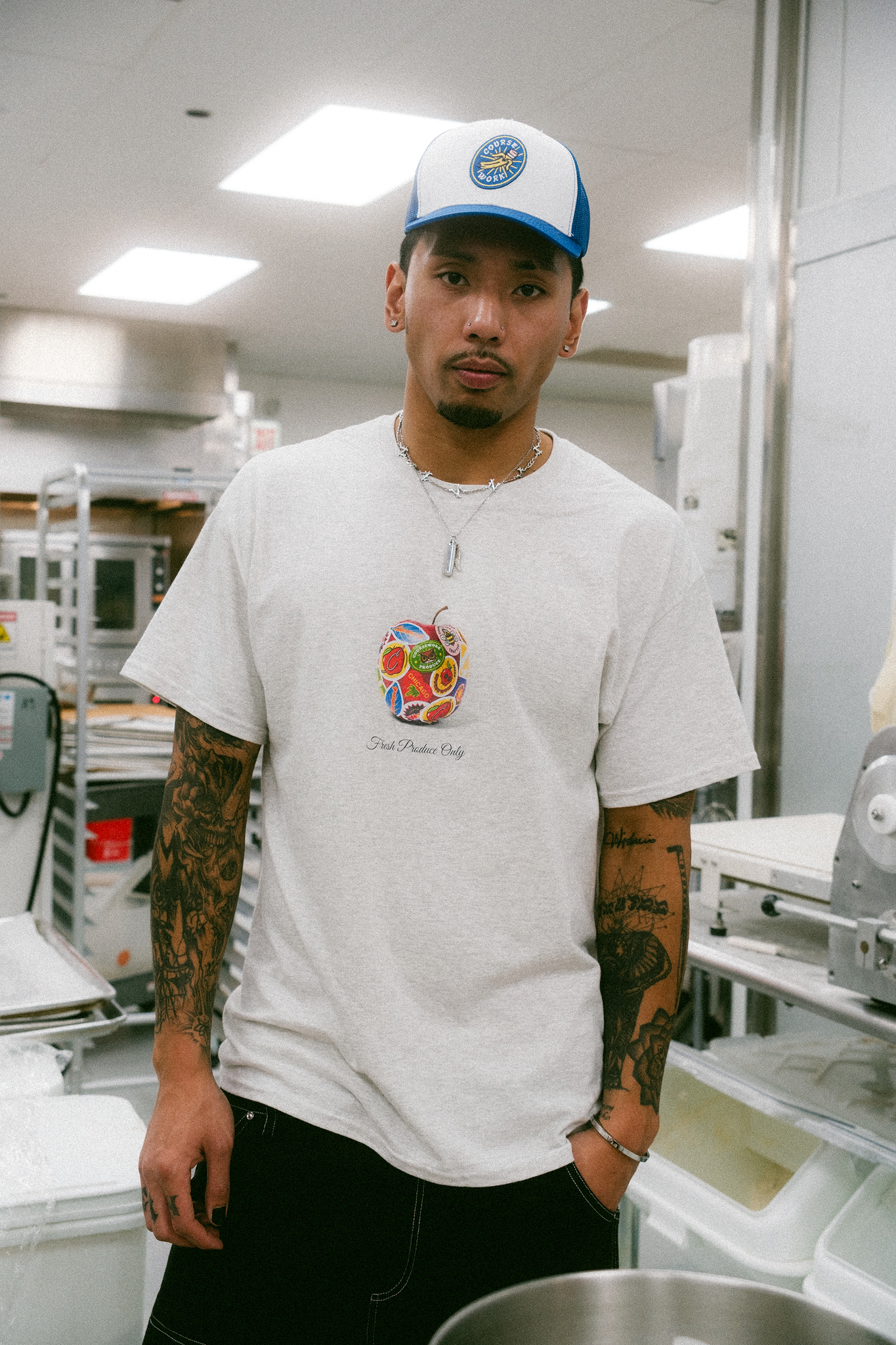 Model stands in the kitchen of a bakery