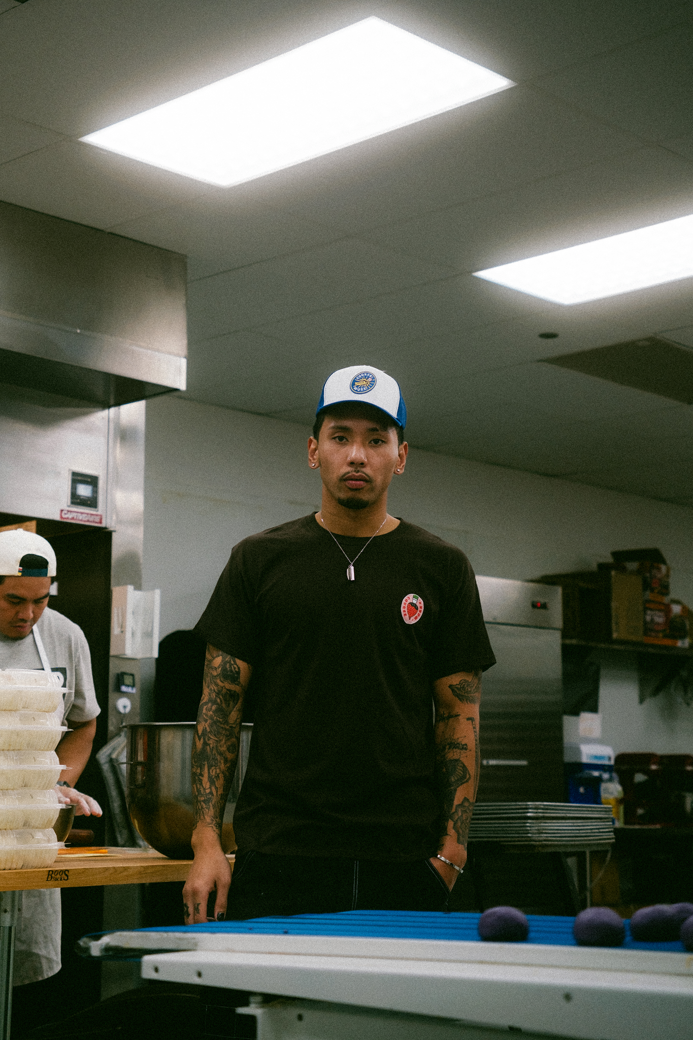 Model stands in kitchen of bakery