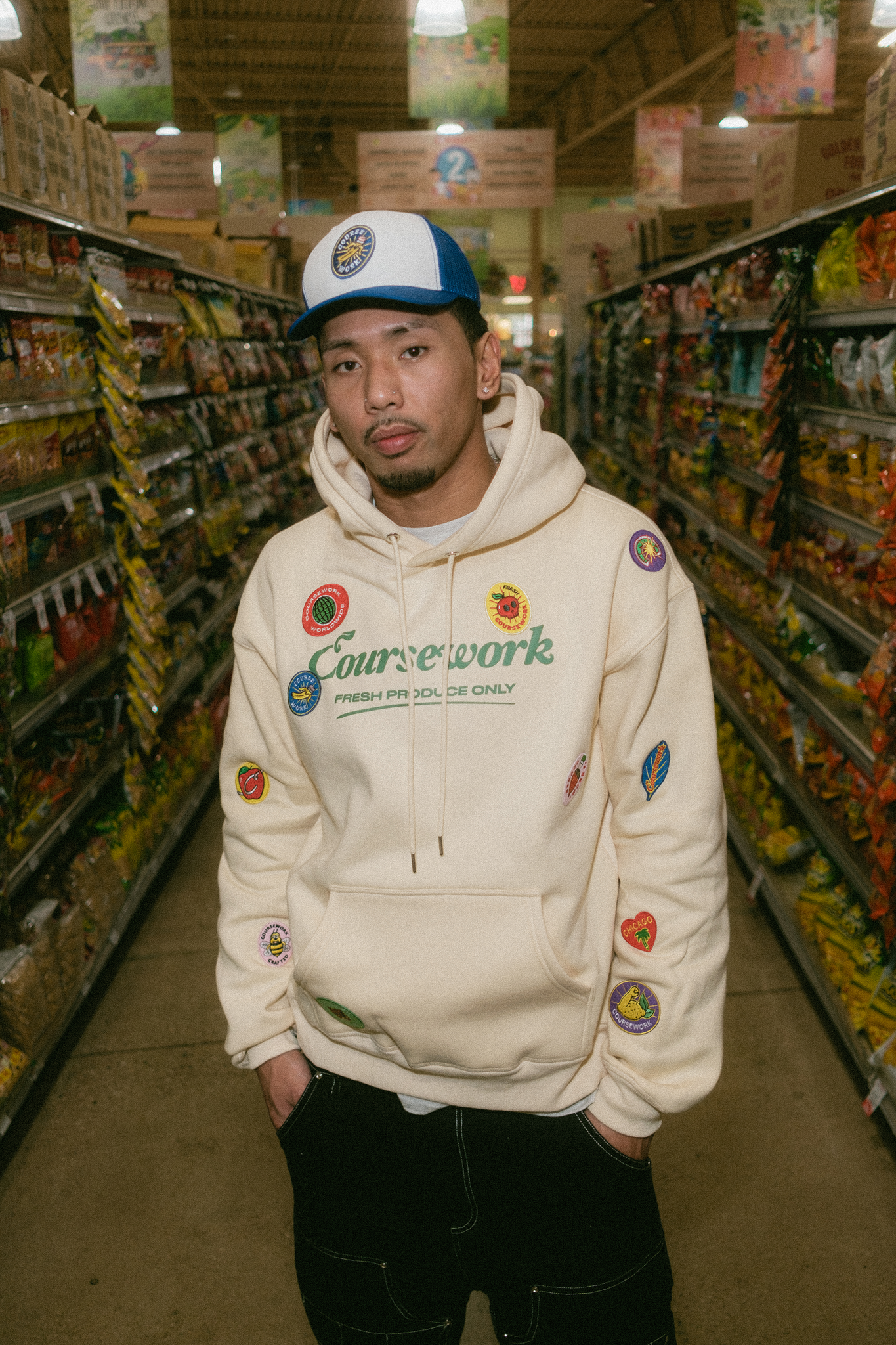 Model standing in center of aisle of grocery store